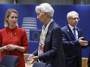 Estonia's Prime Minister Kaja Kallas, left, speaks with European Central Bank President Christine Lagarde during a round table meeting during an EU summit in Brussels, Friday, Oct. 27, 2023. European Union leaders conclude a second day of meetings on Friday in which they will discuss, among other issues, migration.