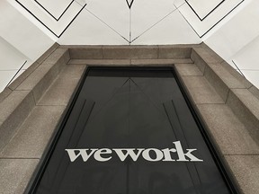 A WeWork logo on a building in New York. The loss of rents from WeWork's departure will hammer the value of the buildings they leave behind.