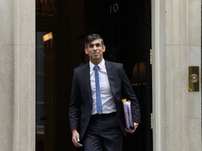 Britain's Prime Minister Rishi Sunak leaves 10 Downing Street for his weekly Prime Ministers Questions at the House of Commons in London, Wednesday, Nov. 22, 2023.