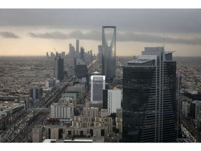 The Kingdom Tower, operated by Kingdom Holding Co., centre, stands on the skyline above the King Fahd highway in Riyadh, Saudi Arabia, on Monday, Nov. 28, 2016. Saudi Arabia and the emirate of Abu Dhabi plan to more than double their production of petrochemicals to cash in on growing demand. Photographer: Bloomberg/Bloomberg