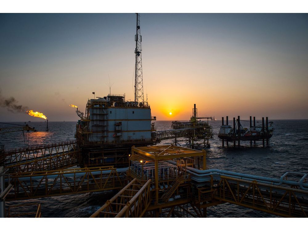 Gas flares burn from pipes aboard an offshore oil platform in the Persian Gulf's Salman Oil Field, operated by the National Iranian Offshore Oil Co., near Lavan island, Iran, on Thursday, Jan. 5. 2017. Nov. 5 is the day when sweeping U.S. sanctions on Irans energy and banking sectors go back into effect after Trumps decision in May to walk away from the six-nation deal with Iran that suspended them. Photographer: Ali Mohammadi/Bloomberg