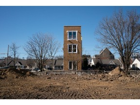 A vacant lot in front of a new multi-family home under construction in Philadelphia, Pennsylvania, U.S., on Saturday, Jan. 30, 2021. Housing starts are set to increase by a further 3% year-on-year and house prices are expected to climb a further 2.5% nationwide in 2021, building on the strength of the second half of 2020, according to J.P. Morgan Research forecasts.