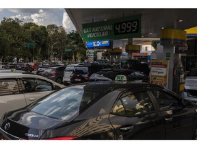 Customers wait in line to refuel vehicles at an Ipiranga gas station in Sao Paulo, Brazil, on Thursday, March 10, 2022. The war between Russia and Ukraine has changed the dynamics of the international fuel market. The shortage of supply has thrown small importers in Brazil off track, and large companies are also feeling the decline in product supply, especially in the diesel oil segment, the Rio Times reports.