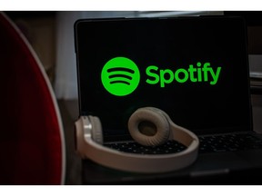 The Spotify logo on a laptop computer arranged in Hastings-on-Hudson, New York, US, on Wednesday, Jan. 25, 2023. Spotify Technology SA is planning to cut about 6% of its employees, or around 600 employees, joining a slew of technology companies from Amazon.com Inc. to Meta Platforms Inc. in announcing job cuts to lower costs.