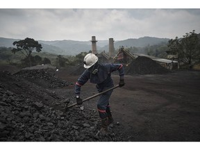A worker shovels coking coal at a Carbomax de Colombia facility near Cucuta, Norte de Santander department, Colombia, Saturday, March 4, 2023. Colombian coal exports grew 14.3% year over year as a consequence of the global demand due to the war in the Ukraine.