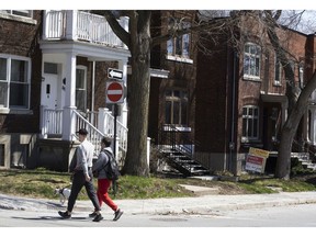 A "Sold" sign outside a home in Montreal, Quebec, Canada, on Saturday, April 15, 2023. Canadian home prices rose for the first time in a year after the country's central bank halted its interest rate hikes and sellers remained hesitant to list their properties.