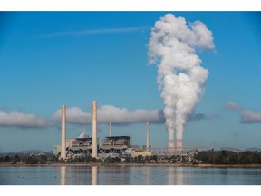 MUSWELLBROOK, AUSTRALIA - APRIL 27: Liddell Power Station stands next to Lake Liddell as chimneys at the Bayswater Power Station emit water vapour on April 27, 2023 in Muswellbrook, Australia. Liddell Power Station, one of Australia's oldest coal-fired power plants, will shut down on Friday, 28 April, after 52 years in operation. The AGL-owned facility opened in 1971 and was once the most powerful generating station in Australia. With Australia making the transition from coal power to renewables, the site will be transformed into a new low-carbon industrial energy hub. Demolition of the plant will begin next year, with more than 90 per cent of the materials to be recycled, AGL says. The closure of Liddell Power Station will stop 8 million tonnes of Carbon dioxide being released into the atmosphere every year, media reported.
