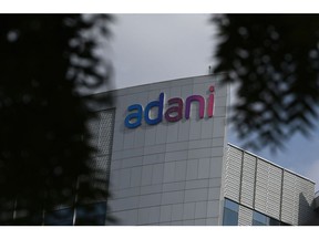 Signage atop the Adani Group headquarters in Ahmedabad, India, on Wednesday, June 21, 2023. US authorities are looking into what representations Adani Group made to its American investors following a scathing short seller's report that accused the company of using offshore companies to secretly manipulate its share prices. Photographer: Prakash Singh/Bloomberg