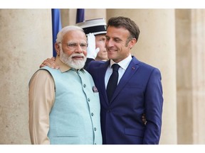Emmanuel Macron, right, and Narendra Modi in Paris in July. Photographer: Nathan Laine/Bloomberg