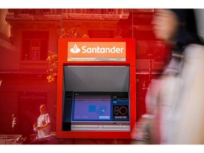 An automated teller machine (ATM) outside a Banco Santander SA bank branch in Madrid, Spain, on Wednesday, July 26, 2023. Banco Santander's earnings beat estimates as its domestic market became the Spanish lender's top profit maker for the first time in more than a decade, boosted by rising interest rates.