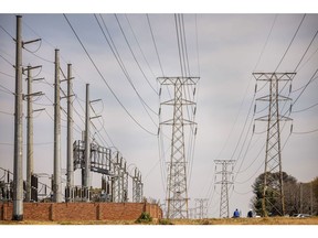 High voltage electricity transmission towers in Johannesburg, South Africa, on Friday, Aug. 18, 2023. South Africa's electricity minister said he expects to seal a deal with the Chinese government next week that will help solar-power installers in the African nation secure access to panels for projects needed to tackle its energy crisis.