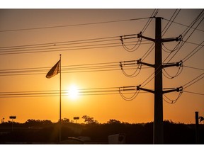 Power lines in Austin, Texas, US, on Friday, Sept. 8, 2023. Texas is in the midst of its worst power crisis since a deadly winter storm more than two years ago, with utilities urging customers to unplug electric vehicles and pool filters to conserve power.
