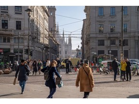 Pedestrians in Piazza Cordusio in Milan, Italy, on Wednesday Nov. 15, 2023. A possible downgrade of Italy to junk this week would be hugely symbolic, potentially consequential -- and very controversial.