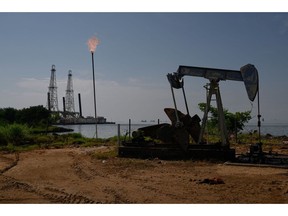 A Petroleos de Venezuela SA (PDVSA) oil pumpjack on Lake Maracaibo in Cabimas, Zulia state, Venezuela, on Friday, Nov. 17, 2023. A decision by the US on Oct. 18 to ease sanctions in exchange for greater political freedom in Venezuela, has opened the doors for dealmaking and increased production that will enable the Latin American country's crude to reach global markets.