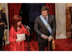 Javier Milei, right, stands by former President Cristina Fernandez de Kirchner during his inauguration ceremony on Dec. 10.