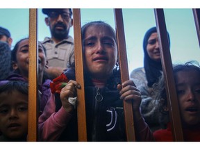 Palestinian children grieve those killed following Israeli airstrikes, at the Nasser Medical Hospital, in Khan Younis, southern Gaza, on Monday, Dec. 11, 2023. The inhabitants of Gaza have been driven south by the fighting, but Israel's campaign has started to move in the same direction.