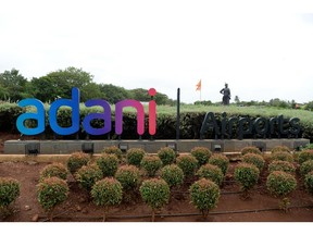 A signage of Adani group in Mumbai  Photographer: Indranil Mukherjee/AFP/Getty Images