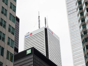 A report by BloombergNEF finds that while Canada's top five banks are among the biggest energy financiers globally, they rank among the worst of the top 100 when measured on how much of that funding is directed to low-carbon sources. TD Bank and Bank of Montreal signage is pictured in the financial district in Toronto, Friday, Sept. 8, 2023.