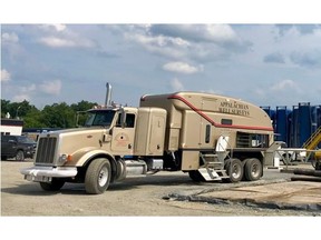 An Appalachian Well Surveys, Inc. mast truck operating on a recent jobsite.