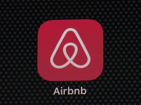 FILE - The Airbnb app icon is displayed on an iPad screen in Washington, D.C., on May 8, 2021. Airbnb reports earnings on Wednesday, Nov. 1, 2023. Short-term rental platform Airbnb has agreed to pay 576 million euros ($621 million) to settle a years-long dispute over unpaid taxes in Italy but said it won't try to recover the money from its hosts.