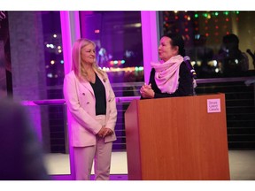 Kimberly Carson, CEO of Breast Cancer Canada, and Susan McPeak, co-founder of the McPeak-Sirois Group for Clinical Research in Breast Cancer, announcing the partnership at the San Antonio Breast Cancer Symposium.