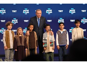 President of Turkey Recep Tayyip Erdogan with children at the TRT World Forum 2023