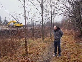 Ryan Deska, Director, Community Engagement & Development, stands on a path next to the site of housing project developed by Guleph's Habitat for Humanity, in Fergus, Ont., on Dec.18. The project was funded with community bonds.