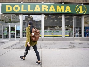 Dollarama Inc. reported its third-quarter profit and sales rose compared with a year ago. A person walks past a Dollarama store in Montreal, Wednesday, June 7, 2023.