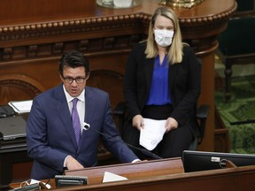 FILE -- Legislative Analyst Gabriel Petek, left, discusses Gov. Gavin Newsom's proposed 2020-21 revised state budget during a hearing the state Capitol in Sacramento, Calif., May 26, 2020. On Thursday, Dec. 7, 2023, Petek said California is facing a $68 billion budget deficit.