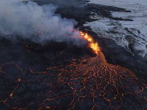 A close up of the Southern active segment of the original fissure of an active volcano in Grindavik on Iceland's Reykjanes Peninsula, Tuesday, Dec. 19, 2023.