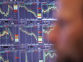 Traders work on the floor of the New York Stock exchange.