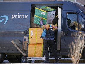 An Amazon Prime delivery person making a stop in Denver, Colorado.