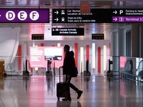 Travellers make their way through Pearson International Airport in Toronto.
