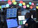 Traders work on the floor of the New York Stock Exchange during morning trading on Dec. 14, 2023, in New York City. 