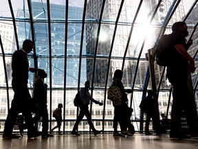 Commuters walk along the concourse after arriving at London Waterloo railway station in London, U.K.