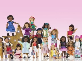 This image shows a variety of American Girl dolls. The toy company Mattel is developing a live-action film based on its American Girl doll line. (American Girl via AP)