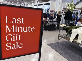 A sign aimed at last minute holiday shoppers is displayed at a retail store in Schaumburg, Ill., Monday, Dec. 18, 2023. Retailers are stepping up discounting and other enticements for the final days before Christmas as they try to lure last minute shoppers who've been waiting to get the best deals in an economically challenging environment.