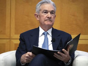 FILE - Federal Reserve Chairman Jerome Powell is introduced at the Jacques Polak Research Conference at the International Monetary Fund, Thursday, Nov. 9, 2023, in Washington. The Fed is set to leave interest rates unchanged while facing speculation about eventual rate cuts.
