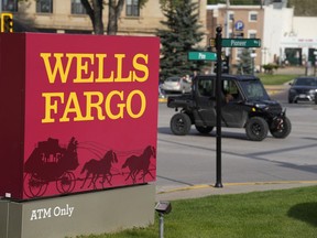 Traffic moves along Pioneer Way past the sign outside a branch of Wells Fargo bank Wednesday, Sept. 20, 2023, in Deadwood, S.D. Employees at a Wells Fargo location in New Mexico have voted to unionize, the first time that workers at a major U.S. bank have attempted to organize.