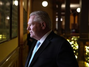 Ontario Premier Doug Ford returns from a news conference in Toronto on Monday Nov. 27, 2023. Ford is expected to announce the government's plan to expand access to beer and wine across the province.