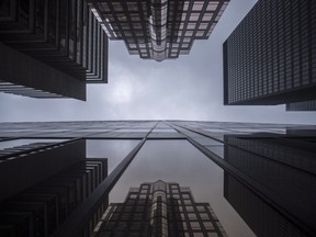 The federal banking regulator is keeping its domestic stability buffer steady at 3.5 per cent. Bank buildings are photographed in Toronto's financial district on June 27, 2018.