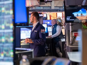 Traders on the floor of the New York Stock Exchange. Stock markets will be focused less on macro risks in the new year, says Dennis Mitchell.