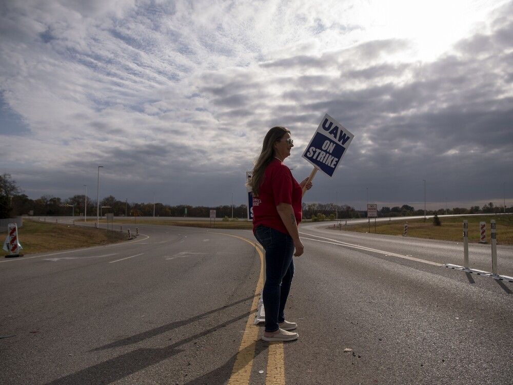 Sherry Barger pickets with other workers near the General Motors plant in Spring Hill, Tenn., on Oct. 29. Autoworkers, nurses, baristas, graduate students, actors and screenwriters all walked off the job in the United States this year, many citing a desire to preserve middle-class lifestyles  squeezed by inflation.