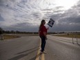 Sherry Barger pickets with other workers near the General Motors plant in Spring Hill, Tenn., on Oct. 29.