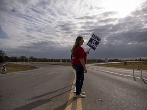 Sherry Barger pickets with other workers near the General Motors plant in Spring Hill, Tenn., on Oct. 29.
