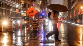 Vehicles and pedestrians compete with a labyrinth of construction on Toronto’s Yonge Street in November.