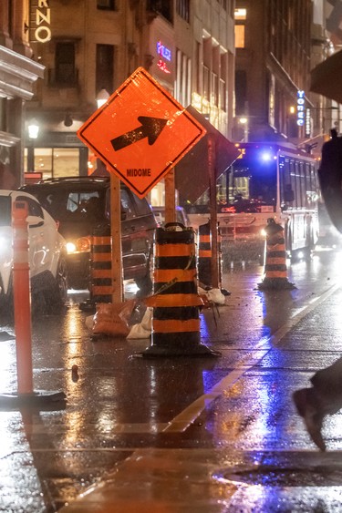 Vehicles and pedestrians compete with a labyrinth of construction on Toronto’s Yonge Street in November.