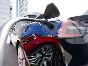 Electric vehicle owners and potential buyers often overlook the logistics and cost of at-home charging setup before bringing their brand-new car to their garages or condo parking lots. An electric vehicle is charged in Ottawa on Wednesday, July 13, 2022.