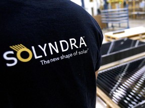 Tyler Fagrey moves completed cylindrical shaped solar cell modules at the Solyndra Inc. manufacturing facility in Fremont, California, U.S., on Tuesday, Nov. 23, 2010. Global manufacturing capacity in the $28 billion solar panel market is set to soar to 30,000 megawatts by 2013 from 10,104 megawatts last year, according to Bloomberg New Energy Finance data. Photographer: Ken James/Bloomberg