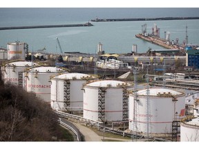 Oil storage tanks stand at the RN-Tuapsinsky refinery, operated by Rosneft Oil Co., in Tuapse, Russia, on Monday, March 23, 2020. Major oil currencies have fallen much more this month following the plunge in Brent crude prices to less than $30 a barrel, with Russia's ruble down by 15%.